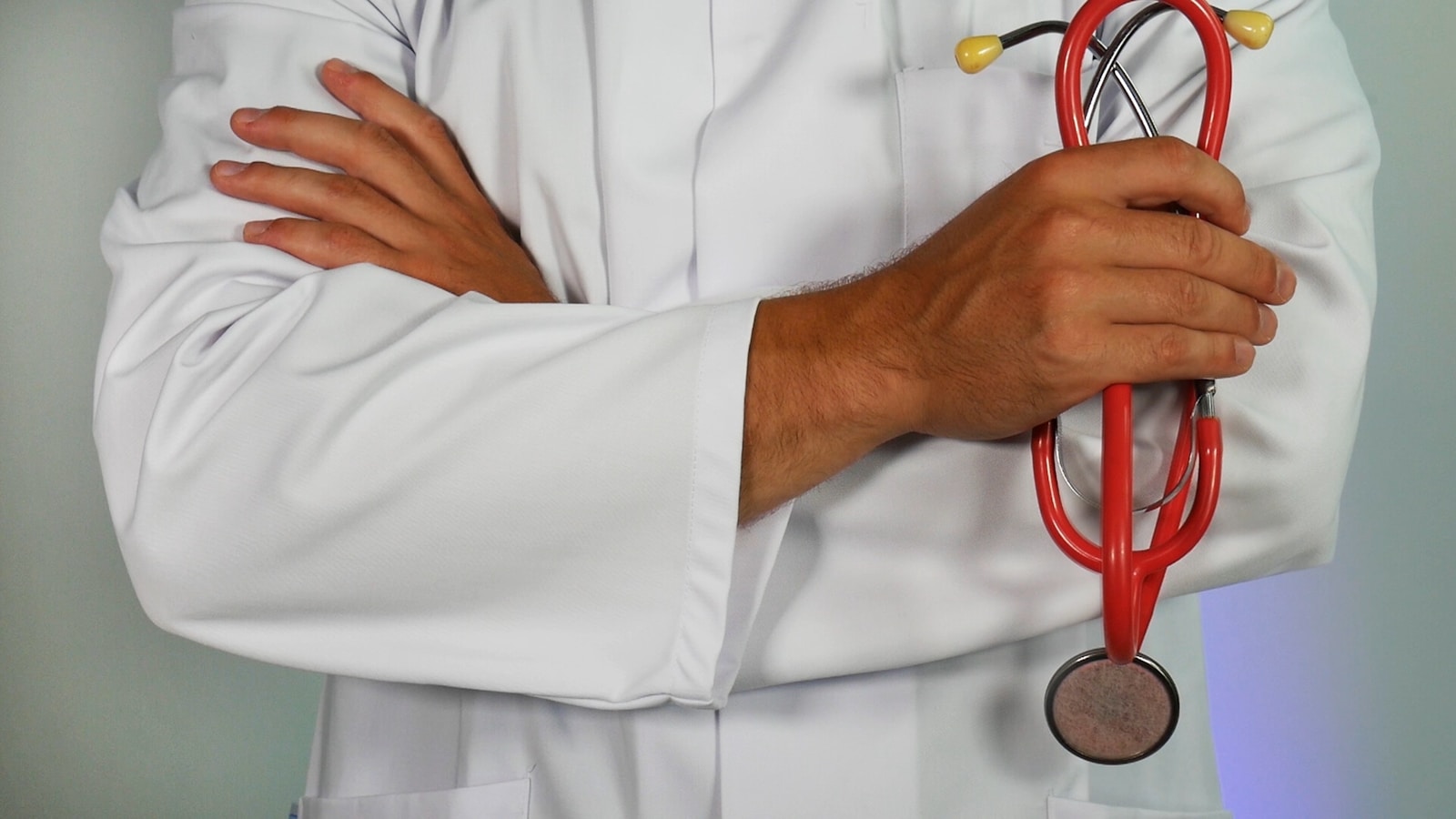 medicare doctor holding red stethoscope
